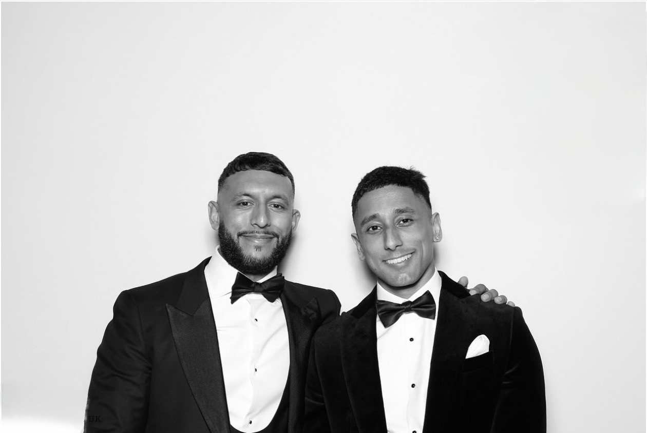 Two guests dressed for an evening celebration
